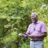 Man Fishing Wearing On the Go medical alert system with fall detection