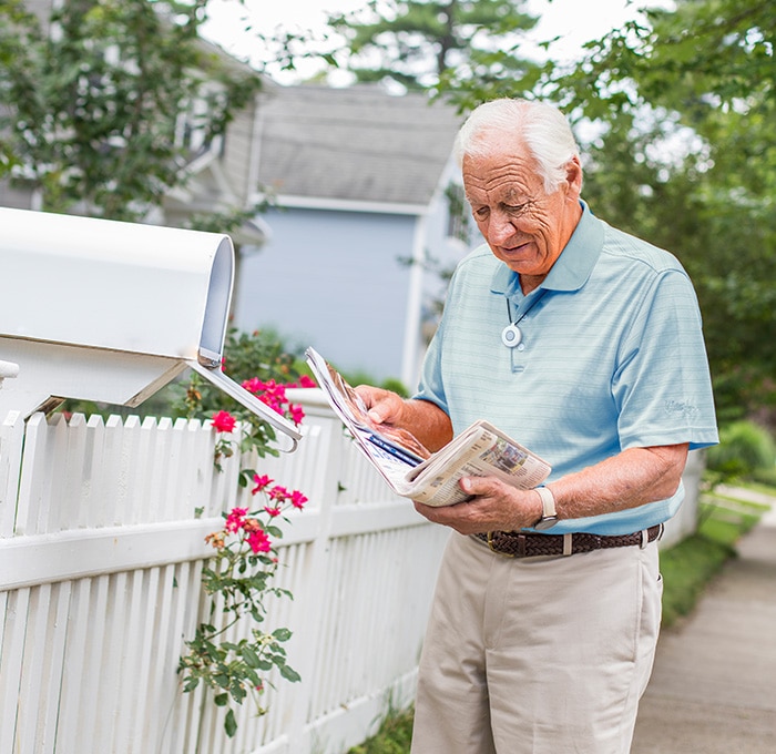 Man at Mailbox wearing HomeSafe