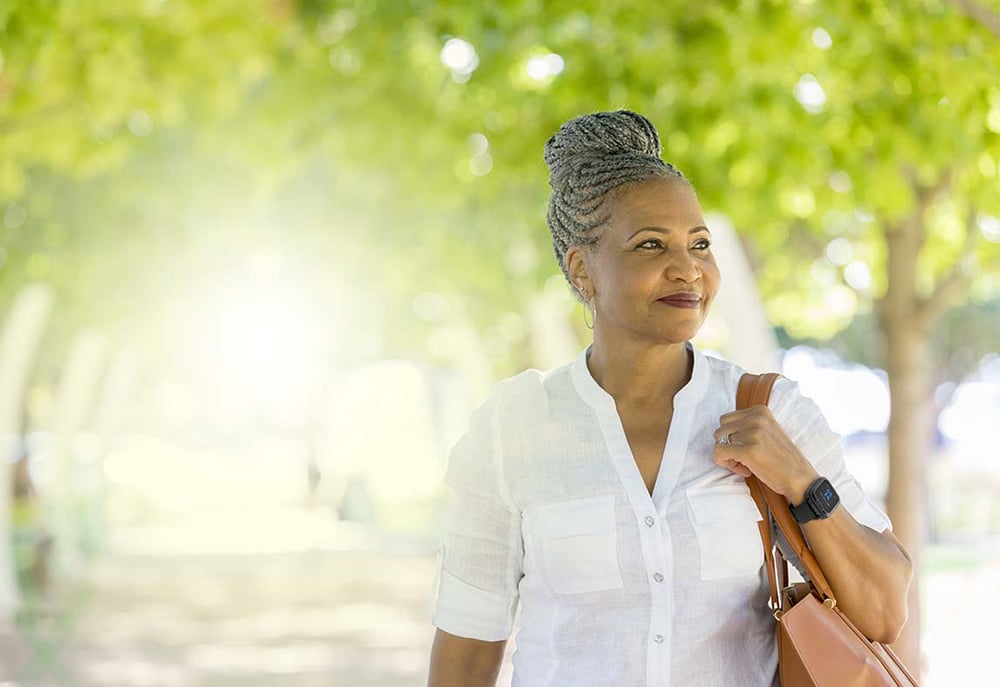 Woman in park wearing Lifeline Smartwatch